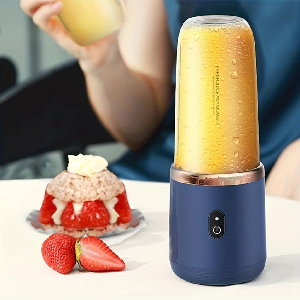 Copo de blender portátil Esen-cia com 6 lâminas elétricas para sucos, smoothies e gelo, em uso com ingredientes frescos.