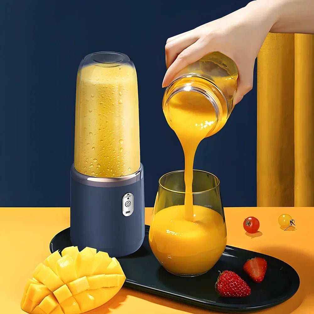 Copo de blender portátil elétrico esen-cia com 6 lâminas para sucos, smoothies e gelo, em uso com ingredientes frescos dentro.